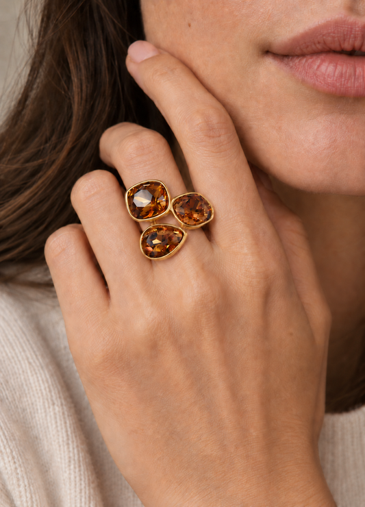 amber crystal trio ring on hand