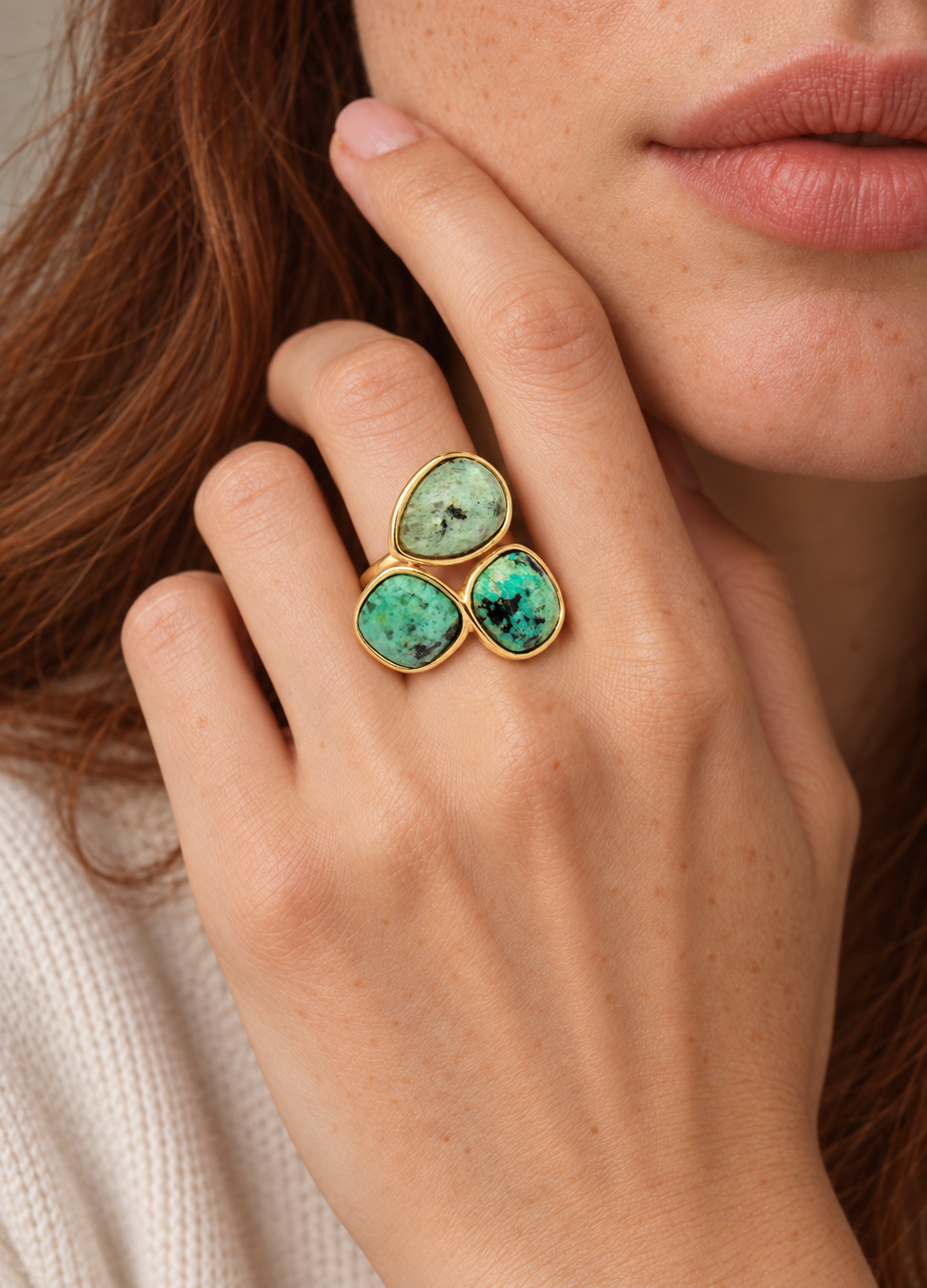 moss green stone trio ring on hand