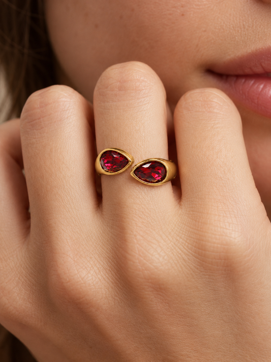 ruby red teardrop bypass ring on hand